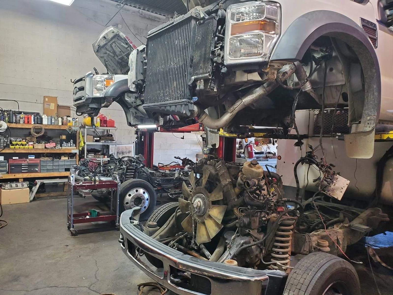Ford Super Duty in the Winners Diesel shop with the cab off for frontend and engine work